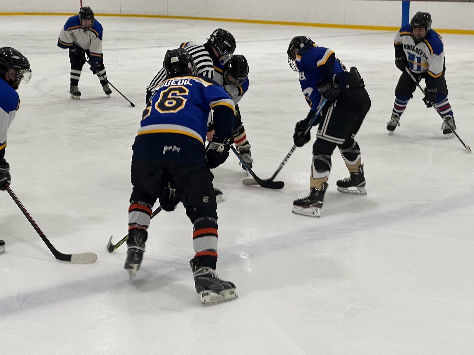 Players lined up for a faceoff during a game